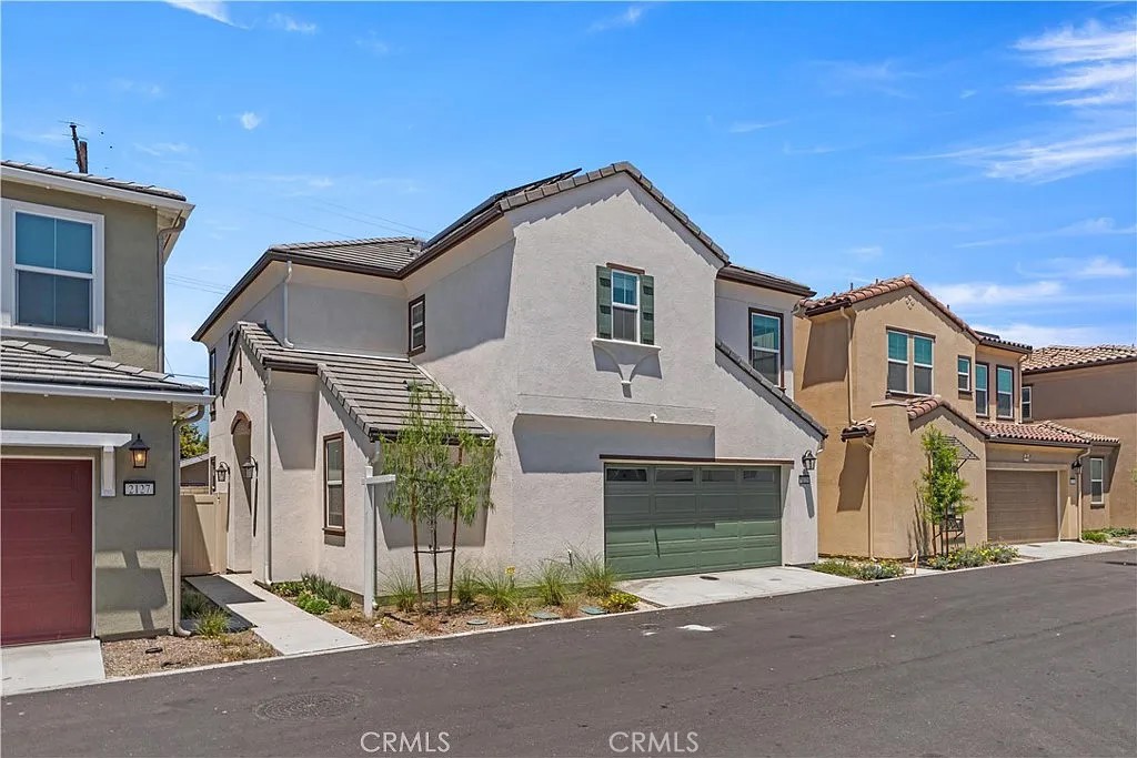 Newer 2024 Solar Single family Home with community pool and play ground!
This two-story home boasts an open-concept layout featuring a bright great room and a stylish kitchen with upgraded cabinetry, quartz countertops, and a spacious center island perfect for entertaining.
Upon entry, you're greeted by a welcoming foyer and a versatile flex room on the right, ideal for a home office with a convenient half bath next to it. Upstairs, the primary suite features a walk-in closet and a luxurious en suite bath with dual sinks, soaking tub, and separate walk-in shower. Two additional bedrooms share a full hall bath, and a spacious loft provides additional living space. The upstairs laundry room includes both gas and electric dryer hookups for added flexibility. Additional upgrades including: new hardwood flooring on stairs and loft, a wireless garage door pad, and plus entry courtyard space with low-maintenance landscaped backyard with concrete patio, artificial turf, planting beds, and an automatic irrigation system. Smart home features include a Schlage electronic front door latch, IQ Panel for device control, Ecobee smart thermostat, and Eero mesh Wi-Fi system for robust connectivity throughout. It also features a spacious 2-bay garage with additional storage space, offering plenty of room for vehicles and belongings. Prime location just minutes from Costco, 85 C Bakery, Crossroads Marketplace in Chino Hills, major freeways, shopping centers, and Cal Poly Pomona. Walking distance to Philadelphia Elementary and Garey Senior High School.