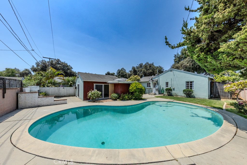 Beautifully remodeled Fullerton Single Story Pool Home with a nearly completed ADU garage conversion. Situated on a quiet cul-de-sac street, this residence welcomes you with an inviting front porch and boasts a wealth of modern upgrades throughout. Step inside to admire gorgeous refinished original wood plank floors and new interior decorator paint. The heart of the home, a brand-new remodeled kitchen, shines with new cabinets featuring convenient pull-outs, new Quartz countertops, and a suite of new stainless steel appliances including a French door refrigerator, 5-burner stove, trash compactor, and dishwasher. The newly remodeled bathroom offers a custom tiled shower. New plumbing, faucets, lighting, and fixtures. For ultimate convenience, an indoor laundry room with included washer and dryer. Central air. A significant highlight is the garage, which has been converted into a spacious ADU (Accessory Dwelling Unit) featuring a loft and an attached bathroom. While the buyer is responsible for finishing this space, it presents a remarkable opportunity for rental income, multi-generational living, a detached 3rd bedroom suite or a home office, which you should independently verify. The spacious 6,540 SF lot is designed for outdoor enjoyment, featuring a private pool, a long driveway, a lush grass area, and a BBQ patio – perfect for entertaining or relaxing. Enjoy the benefits of a prime Fullerton location with no HOA fees and a low property tax rate. The district website shows this home attends Sunny Hills High School. Conveniently located near the Muckenthaler Cultural Center, as well as being close to shopping, parks, and restaurants.