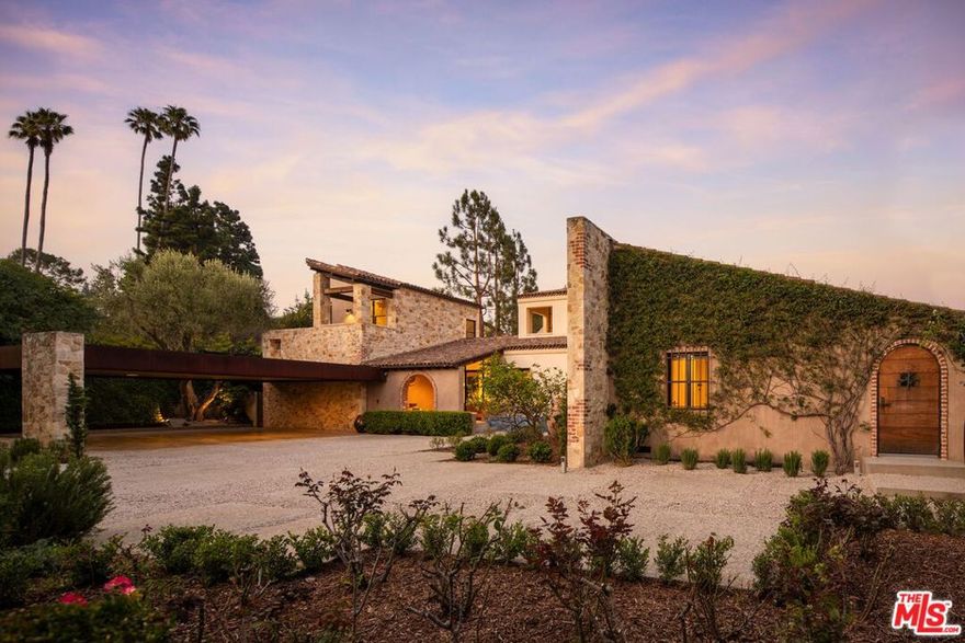 Alpine Ranch, located on one of the most prestigious streets in Beverly Hills, is a gated, custom-built Italian Villa originally designed by acclaimed architects Luis Ortega and Jose Fernandez. It has been fully reimagined as a brand-new home, impeccably redesigned and furnished by Amber Interiors. Every detail of this 5-bed, 5-bath estate has been thoughtfully upgraded, from fully renovated bathrooms, bedrooms, and living spaces to a comprehensive redesign by Amber Interiors. Their curated touches include bespoke furnishings, hand-thrown ceramics, artfully stacked books, and carefully layered textiles all included in the sale for a true turnkey experience. Interior highlights blend rustic charm with refined elegance, including exposed wood beam ceilings, steel-framed windows, and natural stone accents reminiscent of a countryside villa in the South of France. The main level is thoughtfully laid out with a sunlit formal living room that opens to a serene outdoor patio, an inviting dining room, and a chef's kitchen outfitted with Wolf appliances. Four bedrooms are located on this level, including a private primary wing that serves as a true retreat, featuring garden and pool views, a spa-quality bath with rain shower, freestanding tub, and overhead skylights that bathe the space in natural light. Upstairs, a separate private casita and an additional flex bedroom or gym open onto a generous covered balcony and rooftop deck. Set behind gates, the grounds are just as captivating as the interiors. A sprawling motor court offers ample parking for guests, while the expansive grassy yard, resort-style pool, and sun-drenched cabana invite effortless indoor-outdoor living. Thoughtful details like a private outdoor shower and a dedicated pool bathroom add both convenience and charm, creating a true sanctuary for relaxation and entertaining under the California sun.Just moments from the Beverly Hills Hotel and the world-class shopping, dining, and entertainment of Rodeo Drive, Alpine Ranch is a rare opportunity to own a fully furnished, design-forward estate in one of the most iconic neighborhoods in the world.