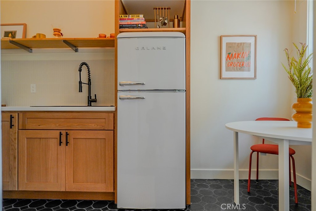Discover this beautifully renovated studio in The Californian, a classic 1920s historic building located in the heart of Downtown Long Beach. This move-in-ready, ground-floor unit offers a perfect blend of vintage charm and modern upgrades. Recent renovations include updated plumbing and electrical, new flooring, tile, paint, lighting, brand-new kitchen, and restored bathroom with period-inspired finishes and modern fixtures.
Enjoy original architectural details like plaster walls, wainscoting, and New lighting fixtures that highlight the unit’s historic character. The secure building features a stunning historic lobby, elevator, rooftop lounge with city views, basement laundry, and private storage.
Located just blocks from the beach, Pine Avenue, The Pike, Long Beach Public Library, and top-rated local dining and shopping. Easy access to public transportation, nightlife, and freeways makes this an ideal home for commuters, first-time buyers, or anyone seeking vibrant urban living.
With one of the lowest HOA fees in the area, this studio is a rare opportunity to own in one of Long Beach’s most iconic buildings. Experience the best of historic downtown living with modern convenience!