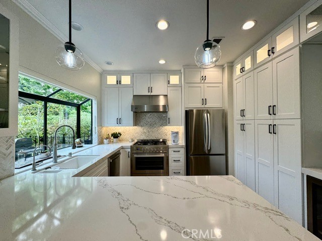 Experience serene golf course living in this beautifully upgraded 2 bed, 2 bath bottom-level condo behind the gates of Coto de Caza. Featuring a bright, open floor plan and a stunning renovated kitchen with stainless steel appliances and quartz countertops, this home offers both comfort and elegance. Enjoy golf course views from the Primary Suite that features two expansive closets, a dual sink vanity and walk-in glass shower. A secondary bedroom, full bathroom, laundry room and an attached garage complete this fantastic home. The condo also features a detached garage, providing two garage spaces in total. Step out onto your private patio to enjoy peaceful views of the golf course and and mature Oak trees. The community offers a pool and spa to enjoy year-round. Located near parks, trails, sports courts, and the private Coto de Caza Golf & Racquet Club, this is an ideal lease for those seeking a relaxed and refined lifestyle only minutes from numerous shopping centers and the toll road.