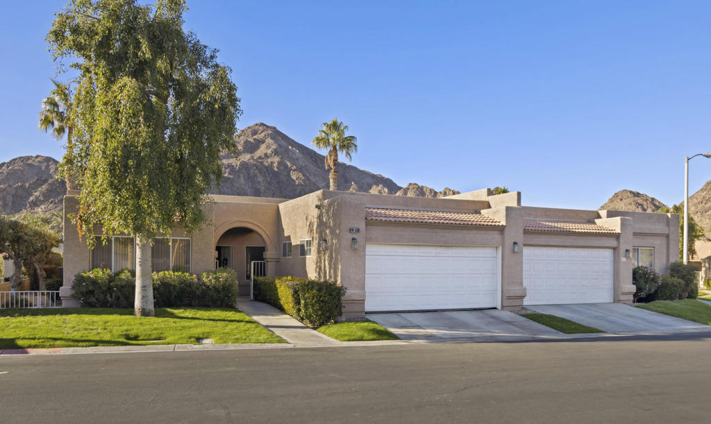 This three bedroom, three bath home just under 2000 sq. ft. is located in the guard gated lake community Laguna De La Paz. You enter thru a gated court yard into a dining and large living room, with a wet bar and fireplace. The main bedroom has a big walk-in closet. double vanity, seperate shower and soaking tub. There is another suite bedroom with it's own bathroom. The thrid bedroom has a built-in desk and murphy bed close to the thrid bathroom. The kitchen has a seperate breakfast eating area. The laundry room leads to the two car garage. The living room and main bedroom both open to the patio with great mountain views. There is a large electric awning that provides plenty of shade, a gas line for your BBQ. There is plenty of space to entertain or just relax. The community has 13 pools and 14 spas, tennis and pickleball courts, large lake with electric and paddle boats, club house and workout room. Lots of social activities. Located close to some of the best that the Desert has to offer. The La Quinta Resort and Spa, Old Town, golf, tennis, dining, concerts, entertainment are all close by. Great for year round or a snowbird lifestyle.Rent is $3000 May thru Sept. $3500 year lease.
