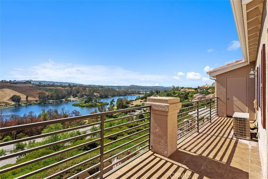 PANORAMIC LAKE AND CITY LIGHT VIEWS.  You'll enjoy coming home to this open floorplan, upgraded two story townhome. Kitchen has just been remodeled to include White Kitchen cabinets topped with Quartz Counters with full backsplash featuring stainless appliances, undercabinet lighting and warm wood laminate flooring. The living and dining rooms feature tall two story ceilings. The living room has a gas/wood burning fireplace faced with tumbled stone.  The dining room has large new Vinyl dual glazed patio doors leading out onto the patio with forever views.  There are 2 bedrooms located on the first level, Enjoy the views from the primary bedroom with large patio door, the en-suite bathroom has dual sinks, large walk in closet with built-ins and a large shower. 2nd level has the loft/3rd bedroom option with private bath and closet.  This is perfect for a 3rd bedroom or home office space.  Most windows have upgraded wood shutters.  Two single car garages.  This Costa Brava community is in the Rancho Niguel area of Laguna Niguel and close proximity to Laguna Niguel Lake & Regional Park, Wood Canyon Park.  Plenty hiking, biking, walking trails and scenic areas for relaxing.  Watch Laguna Niguel's 4th of July celebrations right from your patio. Rancho Niguel also offers its residents membership to "The Club at Rancho Niguel" which has a large gym, pools, tennis basketball and pickleball courts.  playground, tot lot, and clubhouse for events.  Award winning schools, great dining and shopping opportunities are close by. This is a great place to call home.