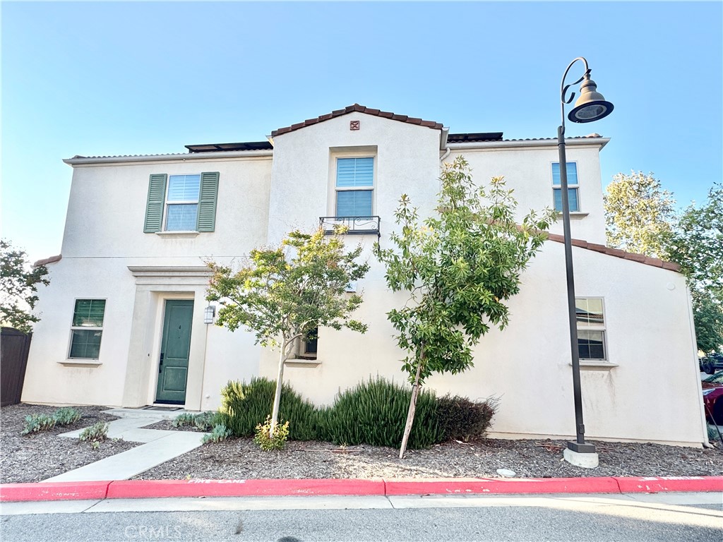 Great Location! This modern Glendora end-unit condo was built in 2016 with beautiful color white wood shutters, all around, carpet, brand new laminated wood installed in the master bedroom, and some tile flooring in the kitchen & bathroom. Discover this stylish 3-bedroom, 2.5-bath condo in the heart of Glendora. It offers 1,450 square feet of bright, open living space with a good-sized backyard. The modern kitchen with stainless steel appliances & granite counter tops island flows into the spacious living and dining areas—perfect for everyday living and entertaining. Upstairs features all 3 bedrooms, a versatile loft, and a convenient laundry room. Enjoy an attached two-car garage and paid-off solar panels for energy savings. It has one of the few condos that has a large 2-car driveway in this community; therefore total of 4 cars can park at the house. Ideally situated near major commute routes, this home combines modern living, comfort, and style with the added bonus of a low HOA. Schedule your private tour today before it’s gone!