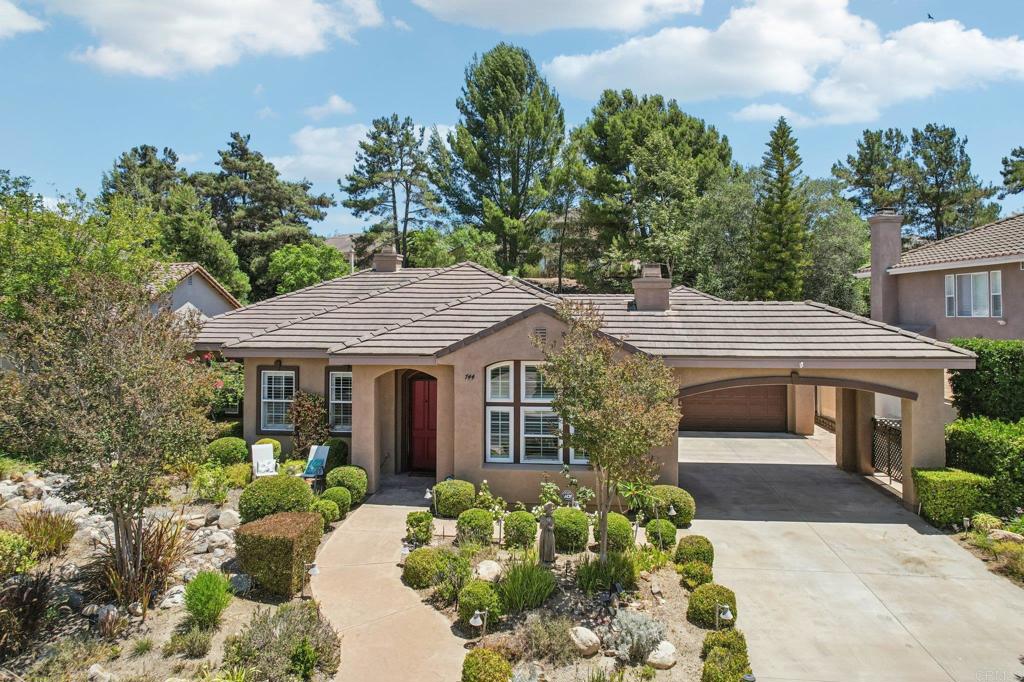 Sprawling single story with pristine curb appeal located in the highly sought-after gated community of Peppertree Park nestled on a quiet interior street surrounded by natural beauty and community charm. Step through the inviting entry that welcomes you with natural lighting, new LVP floors, elegant ceramic tile, and striking chandeliers that set the tone for this light-filled home with flowing formal and casual living spaces. The formal dining room greets you and flows seamlessly into the spacious living room anchored by a cozy fireplace, perfect for entertaining or relaxing. The open-concept kitchen exudes elegance with Travertine countertops, upgraded stainless steel appliances, double ovens, under-cabinet LED lighting, and an expansive center island with bar seating for seven under statement pendant lights. The kitchen overlooks the bright and airy family room, warmed by its own fireplace and lined with windows framing the lush backyard. The stunning primary suite is privately tucked away in its own wing at the back corner of the home where you will enjoys views of the serene backyard. The ensuite Tuscan-style bath features dual sinks, a soaking tub, separate shower, and a spacious walk-in closet. All four bedrooms offer built-in ceiling fans with the fourth bedroom, located at the front of the home behind double doors, offers ideal separation and functions beautifully as a home office, study, or flex space. Tons of upgrade throughout including crown molding, plantation shutters, and two solar dome skylights that fill the home with soft natural light throughout the day. Step outside and escape to the thoughtfully designed backyard featuring a large built-in Alumawood pergola with ceiling fans and lighting, creating an ideal extension of the living space. Relax in the low-maintenance yard or unwind in the swim spa set on a peaceful platform ideal for lounging and entertaining. Take advantage of the master-planned Peppertree Park community amenities including scenic walking trails, playground, basketball court, horseshoe and bocce ball pits, BBQ areas, park benches, and a large grassy field — all within the privacy of a gated community.