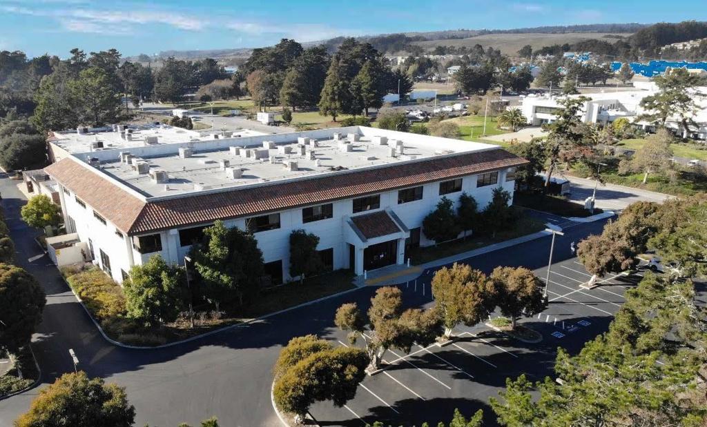 This 44,000 SF two-story office building features high-quality construction and many occupancy options. Windows surround the building, allowing natural light throughout. It features private offices, open space, and solid construction. The second story offers ocean views from sunny private offices and shared spaces. The site has 75 parking spaces shaded by mature trees on a 2.7-acre, flat, easy-to-access site. Located minutes from beaches, hiking, and world-class bicycling and surfing - this property caters to individuals who care about their surroundings and is listed at a price below the replacement cost.