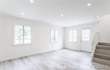 A charming storybook like house on a quiet street, with gated entry to spacious driveway leads to this two-story house, with open floor plan, upon entry there is great room, surrounded with beautiful windows covered with modern cellular shades, laminated floors throughout, open to kitchen with stainless steel appliances, beautiful light-colored cabinets, open to dining area, very light and bright, one bedroom and one bathroom is downstairs with enclosed patio, stackable washer and dryer. On second level there are one bathroom and two bedrooms, one of bedrooms has access to balcony with view of surrounding hills. Easy access to 210 freeway and close to shopping and restaurant.