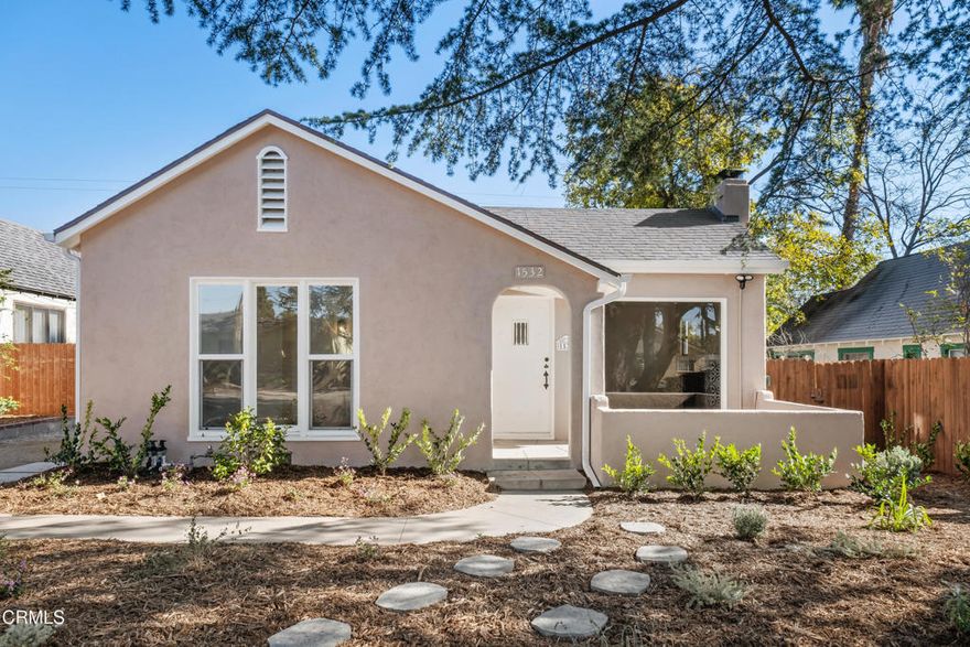Welcome to this charming three bedroom, two bathroom cottage style bungalow located in the desirable Pasadena neighborhood of East Washington Village. The living room features a tray ceiling, designer fireplace, and graceful archway opening to the dining room. The beautifully designed kitchen includes a large quartz island, pendant lighting, stainless steel appliances, and a separate, generously sized laundry room with hookups and plenty of space for storage. The two front bedrooms share a hall bath with a shower-tub combo. The primary bedroom suite is situated at the back of the home and includes the second bathroom with a stall shower, a charming window seat, and an oversized walk-in closet. Includes central AC and heat, Mediterranean landscaping with a drip system, and newer wood-look plank flooring throughout. Off-street parking included.