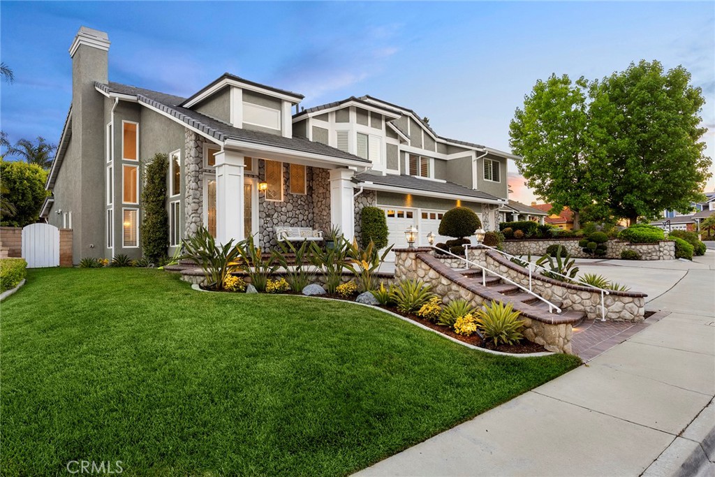 This home offers unparalleled quality at a price that represents true value in today’s market. This marvelously remodeled home presents like a new home. The curb appeal announces “this is a fantastic home” as you enter the double glass doors into an elegant entry. Greeted by marble flooring and high ceilings, then the living room with a fireplace and comfortable seating. Spacious comes to mind. Looking on in the home to the dining room with built in custom cabinetry and granite counter space. A full bar just off the dining room with two wine refrigerators and a prep sink plus granite counter space with seating and custom cabinetry to display glasses and your favorite bottles. Open to the enlarged family room with windows, lighting, cabinet space and great viewing with a large screen TV, sit back and relax or sit at the kitchen bar stools and watch the chef at work. This kitchen satisfies your needs with a built-in SubZero refrigerator, double Café ovens, 5-burner Thermador gas cooktop, top of the line Panasonic microwave and a Bosch dishwasher. Plenty of counter and storage space in this pristine kitchen, even an appliance garage to park those large mixers. There is a second dining area on the other side of the kitchen for breakfast. Finally, a downstairs bedroom and a full ensuite bath for your guest. Upstairs takes you to the incredible primary bedroom suite. Double doors lead into this amazing suite. First, a sitting area with a see-through fireplace. Then the main bedroom with high ceilings and windows to the balcony and the backyard. Beyond the bedroom is an office with built-in cabinets, a large closet, and a slider to the balcony. To finish this suite is the well-designed primary bath with a jetted tub, dual head shower, double sinks in a granite counter, two walk-in closets and a private toilet room. Four additional bedrooms, two are exceptionally large, complete the six bedrooms. Two hall baths, each with dual sinks and full baths to accommodate the upstairs bedrooms. A loft area completes this floor. Great landscaping sets the stage for the spa. Watch the food being prepared on the BBQ set into the rock-sided island that matches the low walls of the landscaping and the trees. With four garages, built-in cabinets, a tankless water heater, newer ACs and furnaces, an excellent roof and solar, you are ready to move in and enjoy luxury living! Don’t miss the opportunity to own this move-in ready, luxury-level home at an exceptional price.