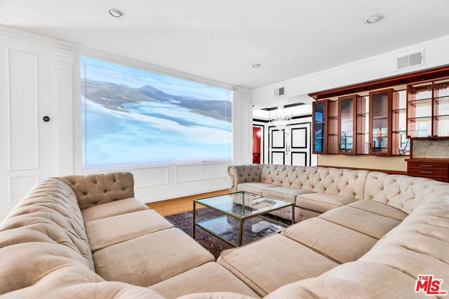 Expansive Designer One Bedroom Retreat in Prime West Hollywood. Moments away from shops and restaurants, Whole Foods, Earthbar, Soho House, Hugo's, Barney's Beanery, Don't hesitate, this is the one you have been waiting for. Rarely does a one-bedroom offer this much space and sophistication. Spanning approximately 1,800 square feet, this light-filled condo combines modern updates with an open, flowing floor plan ideal for both daily living and entertaining. Step through oversized double doors into a formal entry with granite floors, leading to an expansive L-shaped living and dining area wrapped in walls of glass. Eastern exposures drench the home in natural light, while hardwood and bamboo floors, recessed lighting, crown molding, and a fireplace create a refined atmosphere. A unique step-up dining area adds dimension to the layout, with seamless access to the balcony and its lush, greenbelt views. The chef's kitchen boasts custom cabinetry, granite counters, and stainless steel appliances, complete with a casual breakfast area. A Miele washer and dryer are conveniently located inside the unit. The extraordinary primary suite offers true retreat living: a generous sitting area, an extra-large walk-in closet, and a spa-like bath with a separate soaking tub and shower. Building amenities include two side-by-side parking spaces, guest parking, a swimmer's pool, spa, dry sauna, updated lobby, and extra storage. Perfectly situated in the heart of West Hollywood, this home balances privacy, style, and scale, offering an unmatched living experience.