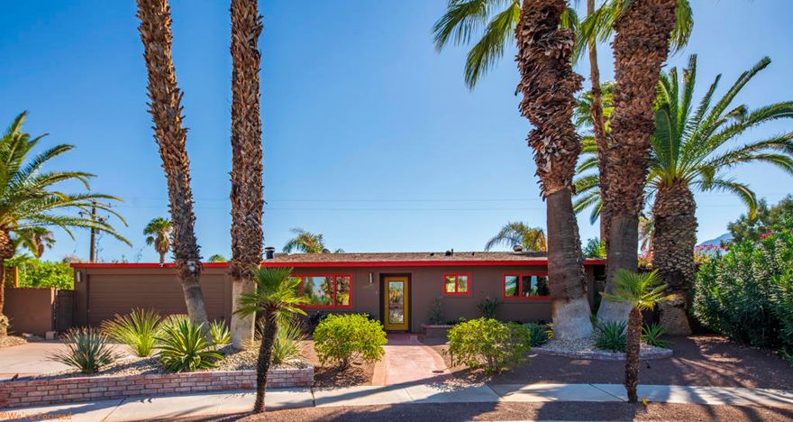 Your Happily Ever After Starts Here: An Oasis of Joy, Light, and Ultimate Privacy! Step into a world where every day feels like a resort vacation. This isn't just a home; it's a private, sun-drenched sanctuary built for pure happiness and effortless living! Experience ultimate privacy and abundant natural light in a space that feels expansive and airy, blurring the lines between indoors and out. Thanks to an open floor plan that seamlessly blends indoor and outdoor living, this home boasts a spacious feel far beyond its square footage. Walls of sparkling glass literally slide away, inviting you onto your magnificent property. The serene pool oasis, framed by lush, vibrant gardens, is calling your name--it's the perfect backdrop for everything from morning laps to glamorous twilight gatherings. The central Great Room is the heart of pure comfort, anchored by a cozy fireplace and offering stunning, sweeping views: a glittering pool to the south and a captivating canopy of palm trees to the north. Creating culinary magic is a delight in the elegant and functional kitchen, featuring gleaming granite countertops and updated cabinetry, all illuminated by energy-efficient Milgard double-paned, low E windows. Sleek, modern tiled floors flow seamlessly throughout, tying every luxurious detail together. Step outside to a picturesque, breathtaking backyard so beautiful it has served as the setting for intimate weddings! Discover multiple, tranquil havens perfect for your well-being--from sun-drenched spots for morning coffee, meditation, or yoga to the ultimate, quiet sanctuary nestled off the primary suite. This private area is ready to be your secure haven for relaxation or a happy play space for your favorite pets! This is a truly remarkable property that promises privacy, beauty, and an unparalleled lifestyle. Its irresistible charm and unique splendor must be experienced in person to truly capture the magic! Don't just dream about a better life--live it here! Home is no longer staged.