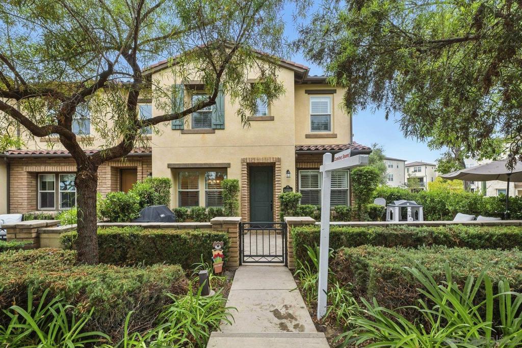 Welcome to this beautifully upgraded 4-bedroom, 3-bath end-unit in the desirable Garretson Townhomes of Del Sur. This highly sought-after floor plan offers a full bedroom and bathroom on the first floor, perfect for guests or multigenerational living. The extended front patio wraps around the home, creating an inviting space for entertaining. Enjoy picturesque views from both the front and back of the home, ideally positioned between two neighborhood parks. Inside, you’ll find wide-plank wood flooring, granite countertops, stainless steel Whirlpool appliances, a spacious kitchen island with breakfast bar seating, and plantation shutters throughout. Abundant natural light fills every room, while the upstairs laundry room provides everyday convenience. Located in the award-winning, master-planned community of Del Sur, this home offers more than just a place to live—it’s a lifestyle. Known for its expansive green spaces and top-ranked schools (Del Sur Elementary School, Design 39, Oak Valley Middle School, and Del Norte High School), Del Sur also provides year-round community events and gatherings. Amenities include 14 parks, 11 solar-heated pools, and easy access to shopping, dining, and schools—all within walking distance. This home truly combines comfort, convenience, and community in one of San Diego’s most sought-after neighborhoods.