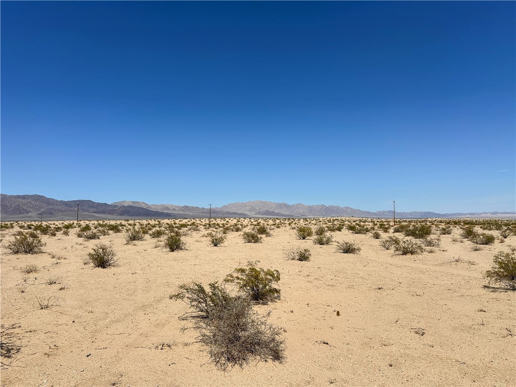 Scenic 2.27 acres in Wonder Valley! Enjoy colorful sunsets and incredible stargazing. Unobstructed views across the desert terrain to mountains in the distance. Walking distance to the Wonder Valley Community Center and Park. Short drive to the world famous Joshua Tree National Park entrance in 29 Palms. Owner May Carry. The seller has other lots on the same street. Property does not have an assigned address - for listing purposes only. GPS: (34.1613804, -115.8979944) APN: 0625-372-12-0000.