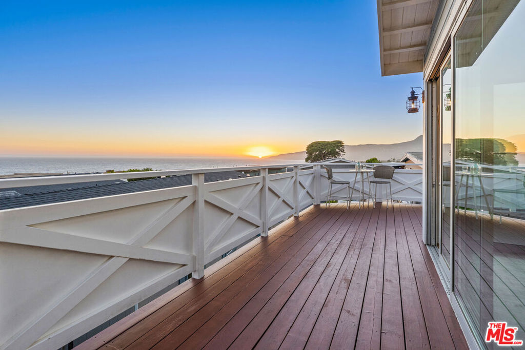Breathtaking ocean views from this beautiful 3-bedroom, 3-bathroom home located in Malibu's exclusive Point Dume Club. The property boasts solid oak flooring, metal roof, custom sliding doors, fenced yard and central heating and air. Additional features include a generator transfer switch and Velux electric ventilating skylights, ensuring comfort, security and efficiency. Expansive wraparound decks provide the perfect space for entertaining or simply relaxing while enjoying the gorgeous sunsets. A large sunroom is the perfect spot to play cards or read a book. There's a spacious covered two car carport with a charging station for an electric car. The Point Dume Club offers a variety of resort-style amenities, including a 24-hour guard gate, community pool and spa, a newly renovated clubhouse (with a fitness center coming soon), tennis and basketball courts, and a dog run. Plus, you can easily take your golf cart to nearby shopping, restaurants, and the stunning Westward and Zuma beaches. Point Dume Club's rent-controlled space rent shown as "HOA" in MLS. Seize the opportunity to live the ultimate Malibu lifestyle.