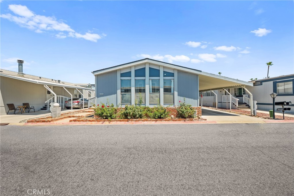 This elegant and beautiful 3-bedroom, 2-bathroom home, spanning 1,344 square feet, is available in the prestigious community of The Lakes at Hemet West, a 55+ guard-gated community. This property features an open-concept living area with vaulted ceilings in the front room, complemented by wood-look vinyl flooring throughout. Upon entering you will notice the peaceful and welcoming atmosphere suitable for both relaxation and entertaining. The kitchen and laundry room are equipped with custom cabinets to ensure organization, while newer stainless steel appliances provide a modern aesthetic. The Lakes at Hemet West Mobile Home Park offers numerous amenities and activities, including a 9-hole golf course, fitness room, swimming pool with BBQ area, library, billiards, ceramics, threaders club, shuffleboard, bocce ball, pickleball court, aquacise classes, and dancing. The Community Center features a full kitchen and a ballroom available for rent for larger events. Residents can enjoy leisurely strolls along scenic paths winding through the park near tranquil lakes. Additionally, there is a dedicated dog park for pet owners. The community is conveniently located across the main road from a shopping center, gas station, and various eateries. This park is considered one of the most beautiful and desirable communities in Hemet. Do not miss this opportunity to acquire this exceptional property. Prospective Buyers must also be approved by Park Management.