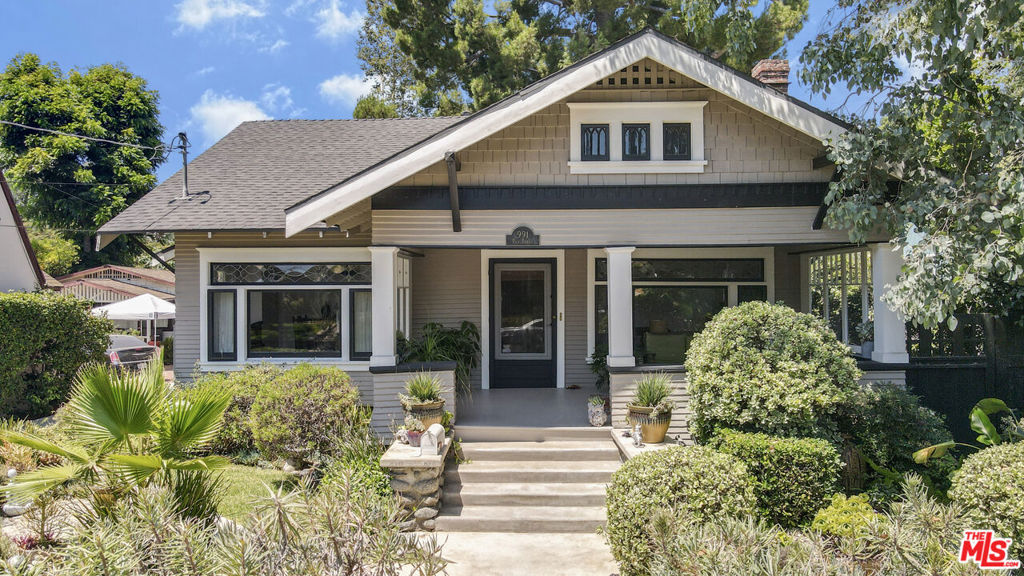 Discover the timeless charm of this 1908 Craftsman Bungalow located in the highly desirable Palm Terrace area, now part of the Washington Square Historical Landmark District in Pasadena. A newly paved walkway welcomes you to the expansive front porch, where original glass side windows from over a century ago add a touch of historical elegance.Inside, the home offers a cozy living room with a fireplace, seamlessly connecting to a dining room adorned in modern, warm tones. This home comprises three bedrooms, with the primary bedroom featuring French doors that open onto a serene wooden deck, perfect for relaxation.This home provides ample room for comfortable living. An additional gem is the newly designed attic space, approximately 450 square feet, ideal for a home office or creative studio.Situated on a spacious 12,553 square foot lot, the beautifully landscaped backyard extends beyond the garage, offering a peaceful outdoor oasis. Modern amenities include copper plumbing, central heating and air conditioning, and automatic sprinklers. The basement provides extensive storage, and there is a convenient easement for the driveway on the south side of the property.Experience the perfect blend of historic charm and modern convenience in this exquisite Pasadena bungalow.