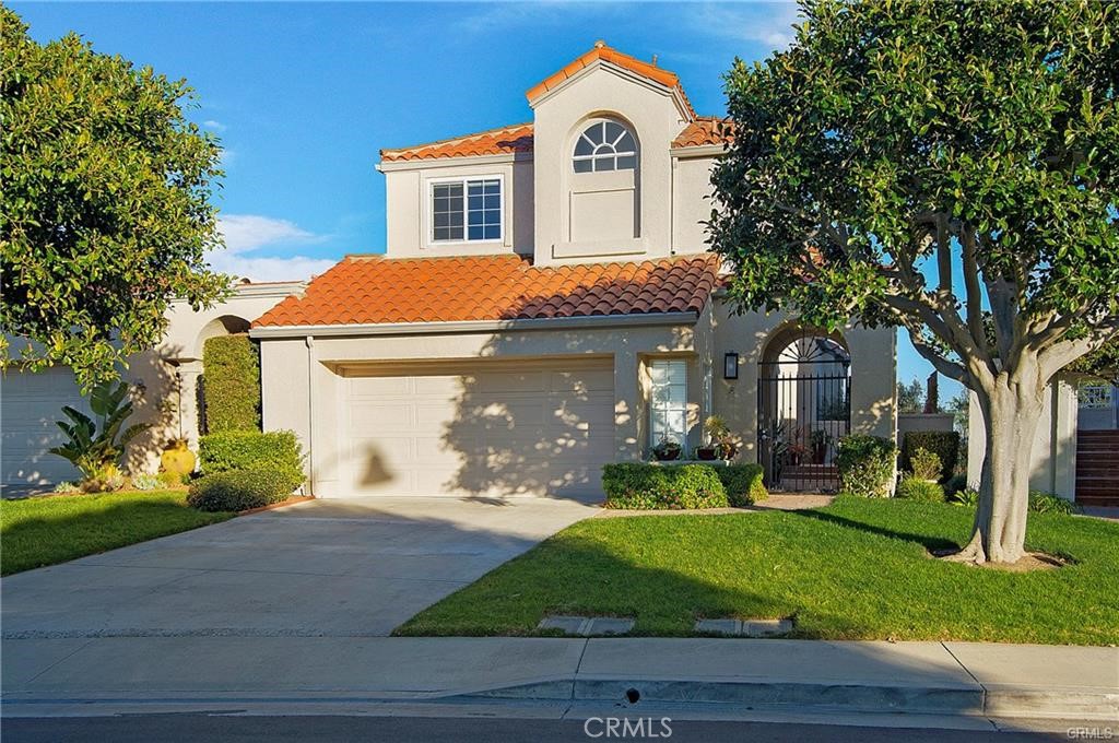 Exquisite attention to details greets you the moment you walk into this lovely family home. Most popular Laguna Sur floor plan features over 2,600 sq. ft. of luxury living. Enter through the enclosed front patio and you will walk into wide open living space with high ceilings, wood flooring and tons of natural light. Dining room has high ceilings and is open to family room with cozy fireplace. Kitchen if oversized with quartz counters and stainless steel appliance. Kitchen nook area with built ins in perfect for morning coffee while you take in the views. Spacious balcony allows the perfect location to enjoy the hills and coastline views. Master retreat is downstairs and truly an oasis. It features two separate areas for home office/exercise equipment or area to relax and read. Master bathroom is luxurious with high end tile shower and designer freestanding tub, dual vanities and large walk in closet. From the master retreat, you enter into a large enclosed yard with expansive views behind the home. Second and third bedrooms are located on upper level and feature Jack and Jill shared bath. Main floor laundry room. Two association pools and spa (one just steps away), tennis courts and community clubhouse. Guard gated Laguna Sur community is located on the hills above South Laguna Beach and the Pacific Ocean. The neighborhood is quiet and serene. Miles of natural hiking trails surround the community.