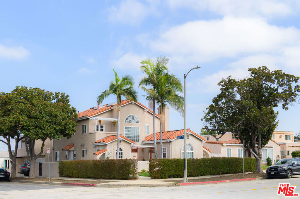 Extraordinary Mediterranean Home + Detached Income - Producing Triplex | Luxury + Investment in highly sought after Manchester Square! Incredible opportunity! Fully remodeled 4 BD/3BA Mediterranean two-story home + 3-unit detached income triplex on a lush corner lot. Gated entry to an expansive formal foyer that opens to the main residence featuring vaulted ceilings, skylights, rich engineered hardwood floors, elegant archways, and natural light throughout. The large living space downstairs includes a spacious living room with fireplace, formal dining w/French doors, a chef's kitchen that boast Viking appliances, granite counters, and butcher block prep area. Kitchen leads to large laundry room equipped with washer and dryer. Included on the lower level is a full bath with separate tub & shower, large bedroom w/wall to wall closet and guest bedroom with ensuite 3/4 bath. Classic staircase introduces the upstairs, private primary suite with fireplace, huge walk-in closet, and a spa-style bath with dual sinks, spacious jetted tub, separate shower, and private toilet space. The 4th bedroom with a balcony and closet is ideal for an office, nursery, or studio. Both levels are equipped with dual zone HVAC for energy efficiency. Head outside to enjoy a tranquil, hedge-lined yard ideal for entertaining and or simply relaxing in private. Located on the west side of the property (Harvard Blvd) is the detached two-story triplex that includes: three updated 1BedRm,1BA units, shared coin-op laundry, 2 single car garages, and tandem/off-street parking. Live in refined comfort while three rental units provide an upside income opportunity. All conveniently located just minutes from SoFi Stadium, the Metro, DTLA, LAX, nearby freeways and more desirable amenities. This one-of-a-kind residence offers the rare chance to live beautifully while investing wisely.