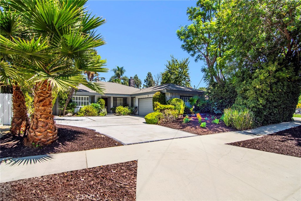 Come embrace this warm, wonderful pool home on an incredible quiet cul-de-sac situated in this sought-after Chandler Estates neighborhood of Sherman Oaks. Newer roof and large concrete drive deliver a pleasing first impression. Childhood memories of fun and frolic are certain to be created on this large concrete driveway & amazing serene street providing an ideal environment for enjoyment. Inside, a large living room with distinct stone fireplace and a unique lighted architectural ceiling accent is enhanced by beautiful vaulted wood beamed ceilings. An adjoining spacious formal dining room offers smooth ceilings and recessed lighting. Separate family room affords a cozy fireplace and classic wet-bar. Spacious and bright kitchen provides ample light wood cabinetry, granite counters, peninsula and an ideal breakfast area. At the east wing enjoy a secluded bedroom and bathroom. Your primary suite features a private bath with convenient rear yard access. Two additional bedrooms and a full bath add to the appeal. Outside, discover a large gated covered dining/entertaining arena that leads to a private rear yard with huge refreshing pool. Just down the street to Sherman Oaks Rec Center/park, brand new Trader Joes, Westfield Fashion Center & all the shops & yummy eateries that line the Blvd. Don’t miss!