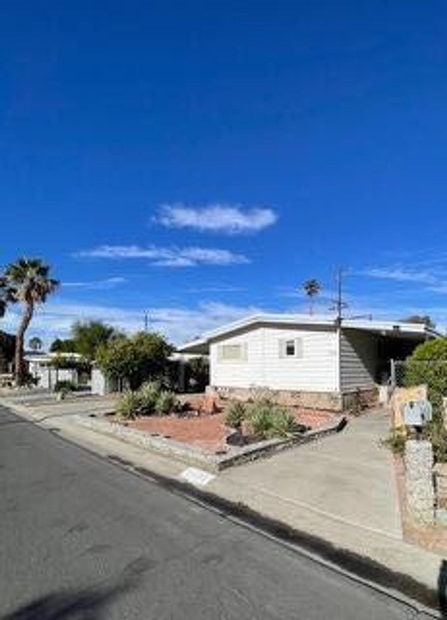 Charming Updated Golf-Course Home with Panoramic Views in Tri Palm Estates & Country Club!Discover affordable desert living in this beautifully updated 2-bedroom, 2-bath home perfectly situated on the 16th fairway, offering serene views of the pond and sweeping mountain vistas. Enjoy the scenery from your spacious wraparound deck--ideal for morning coffee, evening relaxation, and entertaining.Inside, the home features an updated kitchen with new appliances, fresh Luxury Vinyl Plank flooring, and taped & textured walls for a clean, modern feel. New double-pane windows enhance energy efficiency and comfort. This home is offered fully turnkey furnished, including all appliances--just move right in and start enjoying the lifestyle.Tri Palm Estates is an active 55+ community where you own the land, and ownership includes free, unlimited golf on both the 18-hole course and 9-hole par-3 course. Additional amenities include swimming pools and spas, tennis, pickleball, basketball, shuffleboard, a putting green, and a vibrant clubhouse with a banquet room, restaurant, bar, billiards, and free Wi-Fi.  Conveniently located near Costco, Home Depot, Agua Caliente Rancho Mirage Casino, Eisenhower Health, and the acclaimed Acrisure Arena. With quick access to I-10, you're just minutes from the shopping, dining, and entertainment of Rancho Mirage, Palm Desert, and downtown Palm Springs.A wonderful opportunity to enjoy resort-style living with exceptional value--don't miss it!