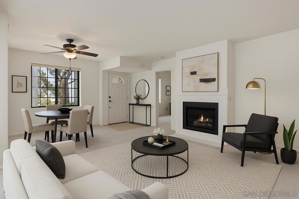 Situated in the desirable Sun Ridge Vista enclave of Rancho Peñasquitos, this thoughtfully updated one-bedroom, one-bath residence blends refined comfort with effortless convenience. Nestled on the second floor, the home is bathed in natural light from expansive windows that frame the airy living room anchored by a cozy fireplace. The open-concept design flows seamlessly into the dining area and a charming covered patio—an ideal extension for morning coffee or al fresco entertaining—complete with additional storage and an in-unit washer and dryer. A well-appointed kitchen boasts gas cooking, generous cabinetry, and ample countertop space, while the serene bedroom features a large closet and a beautifully refreshed ensuite bath. Newly adorned with fresh interior paint, plush carpeting, and central air and heating, this turnkey residence also includes a dedicated covered parking space. Residents of Sun Ridge Vista enjoy a resort-inspired lifestyle with access to sparkling pools, a rejuvenating spa, and a well-equipped fitness center. Adjacent Sun Ridge Vista Park provides an added outdoor retreat with playgrounds, basketball courts, and scenic walking trails. Ideally positioned near shopping, dining, and convenient freeway access, this home offers the perfect balance of convenience and tranquility in one of North County’s most sought-after communities. An exceptional opportunity for homeownership—within a VA- and FHA-approved community—this residence is not to be missed.