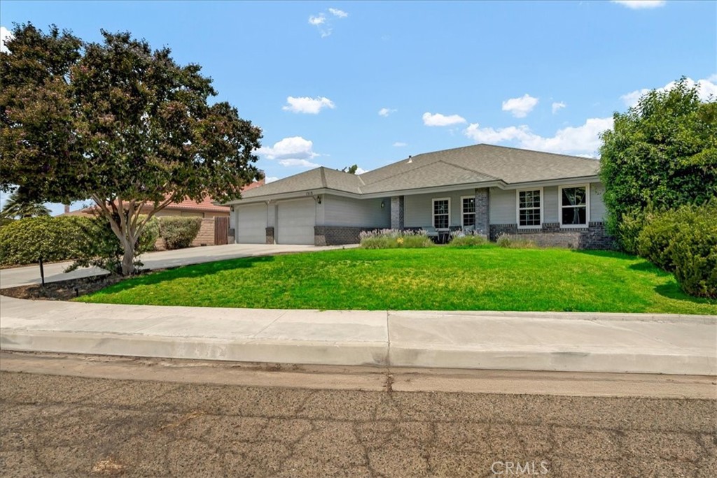 Welcome to 1510 W Median Circle! This custom-built 3-bedroom, 2-bath home is tucked away on a quiet cul-de-sac in desirable Northwest Porterville. Thoughtfully designed with charm and character at every turn, it features a spacious, open layout with vaulted living room ceilings that create an airy, inviting atmosphere. The functional kitchen boasts granite countertops, double ovens, a walk-in pantry with ample storage, perfect for both everyday meals and special gatherings. The primary suite offers backyard access, a generous walk-in closet, and a peaceful retreat feel. Enjoy relaxing on the covered patio overlooking the fenced yard, ideal for outdoor living. With solar panels for added energy efficiency, this home blends timeless style with modern practicality. Conveniently close to schools, parks, and local amenities, it's the perfect mix of comfort, quality, and custom detail.