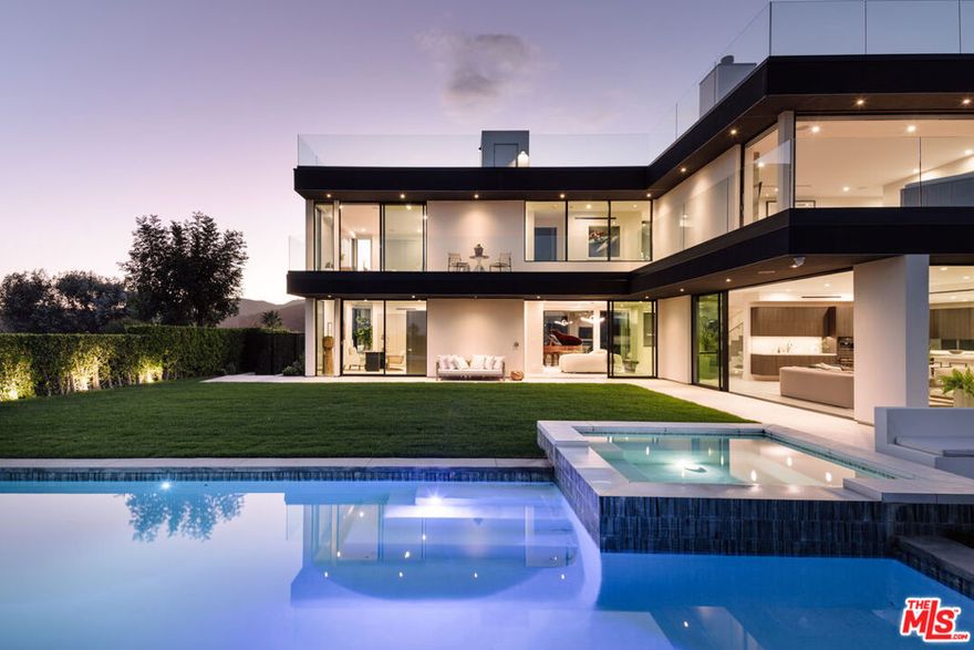Experience modern California luxury in this architecturally stunning Brentwood estate, completed in 2020. This newer construction home features 5 bedrooms, 5.5 bathrooms, and approximately 6,468 sq ft of refined living space set on a 9,724 sq ft lot with breathtaking panoramic views stretching from the Pacific Ocean to Downtown Los Angeles. Designed for contemporary living, the open-concept floor plan showcases soaring ceilings, floor-to-ceiling glass walls, and designer finishes throughout. The gourmet chef's kitchen offers top-of-the-line appliances, sleek custom cabinetry, and a statement island ideal for both entertaining and everyday life. Luxury amenities include a private movie theater, temperature-controlled wine cellar, and a 1,600sqft. rooftop deck capturing 360-degree views of the city and coastline. Outdoors, enjoy resort-style living with a sparkling pool and spa, built-in BBQ, and fire pit lounge  perfect for hosting gatherings under the California sunset. Located in one of Brentwood's most desirable neighborhoods, this modern estate is just minutes from scenic hiking trails, Santa Monica beaches, and the heart of the Westside. A rare opportunity to own a move-in ready luxury home in Los Angeles, offering the perfect blend of elegance, comfort, and iconic Southern California lifestyle.