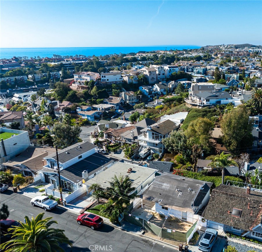 Create Your Dream Coastal Home with Panoramic Ocean Views in Dana Point.
Discover a rare opportunity to own a premier ocean-view homesite in one of Dana Point’s most coveted hillside neighborhoods. This unique property includes pre-approved plans for a striking 2,000 sq. ft. contemporary residence featuring 3 bedrooms and 2.5 baths—designed with both style and the coastal lifestyle in mind.
The plans for the new home will have a modern layout that emphasizes indoor-outdoor living, with two expansive rear decks and a spacious rooftop deck perfectly positioned to capture dramatic sunsets, sweeping ocean vistas, and refreshing sea breezes. Whether you envision a full-time residence or a weekend getaway, this property will offer the perfect canvas for your coastal dream.
Highlights Include:
• Exceptional Setting – Located in one of Dana Point’s most desirable hillside communities.
• Spectacular Views – Panoramic ocean outlooks from multiple outdoor living spaces.
• Ready-to-Build Plans – Pre-approved for a sleek, modern home with high-end finishes.
• Prime Convenience – Minutes to Dana Point Harbor, The ROW, beaches, dining, and shopping.
• No HOA – No homeowner association restrictions or fees.
• Limitless Potential – A rare chance to design a luxury home in a neighborhood known for upscale coastal living.
Whether you choose to move forward with the approved new-build plans or renovate the existing home, necessary foundation repairs will need to be addressed first. A detailed estimate from a trusted Dana Point foundation specialist is available—contact us for more information.
Opportunities like this are few and far between—secure your slice of paradise today!