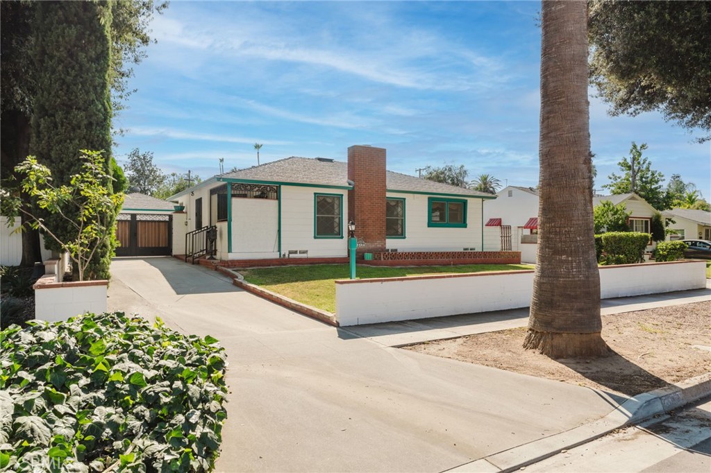 First time on the market since 1973, this charming 2-bedroom, 1-bath home offers 1,038 sq ft of vintage character and untapped potential in a desirable tree-lined neighborhood. Built in 1955, the home is filled with natural light and features a spacious living room with a cozy fireplace and an attached formal dining area, original diamond-pane windows, and classic built-ins throughout. Pull up the carpet to uncover original oak hardwood floors waiting to shine again. The kitchen includes a laundry closet with a utility sink and an eat-in nook, perfect for casual meals. A refinished covered patio creates a versatile indoor-outdoor space overlooking the backyard. The long driveway includes a gated area leading to a detached 2-car garage with alley access making it an ideal setup for a potential ADU for separate entry and parking. With a brand-new HVAC system already in place, this home is perfect for investors, first-time buyers, or downsizers ready to restore and personalize a true mid-century gem.