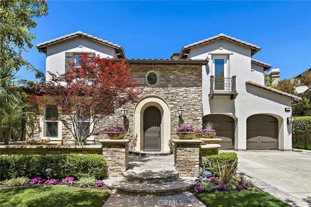 Luxurious Entertainer’s Dream Home with Panoramic Sunset Views! Located on one of the most coveted single-loaded cul-de-sac streets, this custom 5-bedroom, 5.5-bathroom estate spans nearly 5,000 square feet of thoughtfully designed living space on a 9,126 square foot lot. Enjoy the ultimate in privacy, elegance, and functionality with formal and casual living spaces that seamlessly flow indoors and out. Upon entry, you'll be welcomed by a sunlit foyer with lofty ceilings and views to a central courtyard. The heart of the home is the remodeled chef’s kitchen, complete with quartz countertops, Sub-Zero and Thermador appliances, wine fridge, new trash compactor, and custom cabinetry reaching to the ceiling. A spacious walk-in pantry, a custom hood and several picture windows complete this stunning space. Multiple living areas feature newer flooring throughout, custom built-ins, fresh paint inside, crown molding, LED recessed lighting and stunning views. Step outside into an entertainer’s paradise featuring a built-in barbecue island with seating, covered outdoor living space, a custom fireplace, water feature, pool and spa and an expansive side yard w/ synthetic turf— all set against jaw-dropping sunset and canyon views. Additional highlights include a serene interior courtyard with a custom fountain, a versatile third-level loft perfect for an in-home office or teen room and a three-car tandem garage outfitted with custom cabinetry, storage racks, and a tankless water heater. Upstairs, find four generous en-suite bedrooms and a spectacular primary suite with a private retreat, balcony, built-out cedar closet and a spa-inspired marble and stone bathroom. This exceptional home is further enhanced by fully OWNED SOLAR, whole-house epoxy repipe, dual-pane glass windows and plantation shutters. Every inch of this residence is designed for luxurious living and effortless entertaining in the premier South Orange County location of Covenant Hills.