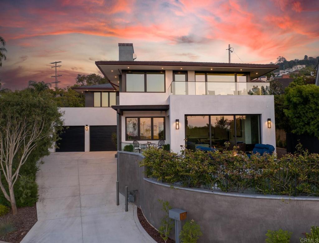 Perched on an elevated lot, this warm modern coastal retreat built in 2021 captures the quintessential views of La Jolla Shores and provides the coveted lifestyle that accompanies it. A pristine home constructed with superior quality custom finishes and design elements combining tones and textures evoking a sense of serenity for the most discerning buyer. Gourmet Kitchen with Sub-Zero Refrigerator along with additional drawers for fridge and freezer, Wolf 6 burner Gas Stove, Miele Dishwasher, dual sinks and attentively designed for maximum storage. Bar and wine fridge along with outdoor living areas in both front and back make this property well equipped for entertaining. Fleetwood doors provide seamless transition between indoor and outdoor living to maximize space and opportunity. Stunning primary suite includes a sitting area with fireplace, private deck, spa bathroom, 2nd washer & dryer within the primary closet and panoramic ocean and coastline views from every vantage point. Stroll to the surf & sand, delicious dining spots or savor time in your own private paradise. Gaze at the blue pacific, rugged coastline, swaying palm trees and relish refreshing ocean breezes. Turnkey Luxury. Unparalleled home, Unparalleled lifestyle.