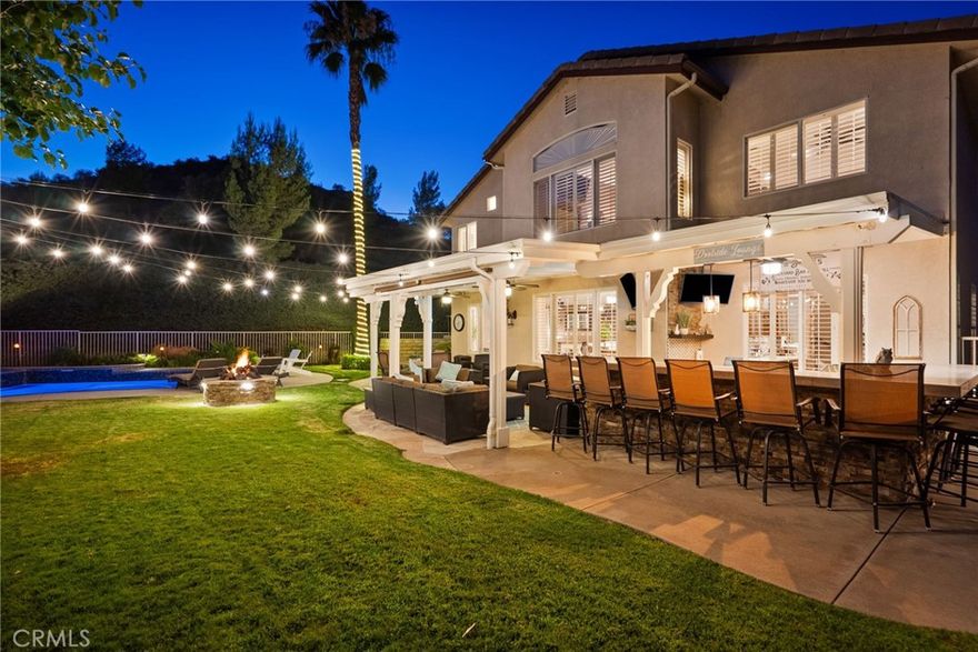 Stunning Family Home with Exceptional Outdoor Living

This stunning home offers the perfect blend of comfort, style, and entertainment, featuring both luxurious indoor spaces and remarkable outdoor amenities. Located in a highly desirable neighborhood, end of the cul de sac, with room for your RV, it’s just a short walk to award-winning elementary and junior high schools—making it an ideal choice for families seeking convenience and access to top-tier education. The open-concept living area provides a spacious and inviting atmosphere, perfect for hosting gatherings with family and friends. Step outside and you’ll find a true outdoor oasis. A sparkling saltwater pool with new Pebble Sheen finish and 2 Baja steps invites you to unwind in style. The covered patio comes complete with a custom-built BBQ & bar, and 3 TV's, ideal for hosting summer parties or enjoying a quiet evening under the stars, this backyard has it all. Nearby, a dedicated play area gives children a safe and fun space to enjoy, while a charming swing tucked under mature pine trees adds a peaceful retreat within your own backyard. For those who love to entertain, the home includes both indoor and outdoor bars, creating seamless spaces for socializing no matter the season. Whether you’re hosting a casual barbecue or cheering on your favorite team during game day, there’s plenty of room to gather and enjoy. Additional highlights include a spacious 3 car attached garage for ample storage and meticulously maintained landscaping that enhances the home’s curb appeal and provides lush, green surroundings year-round. Conveniently located near parks, shopping, dining, and excellent schools, this home is perfect for those who value a vibrant, family-friendly lifestyle without compromising on comfort or style. Don’t miss your chance to experience all that this exceptional property has to offer. NO MELLO ROOS & NO HOA!!!