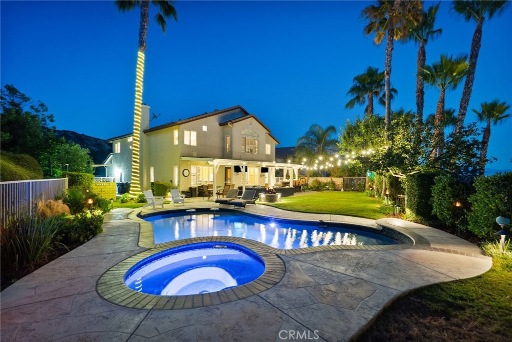 Stunning Family Home with Exceptional Outdoor Living
This stunning home offers the perfect blend of comfort, style, and entertainment, featuring both luxurious indoor spaces and remarkable outdoor amenities. Located in a highly desirable neighborhood, it’s just a short walk to award-winning elementary and junior high schools—making it an ideal choice for families seeking convenience and access to top-tier education. The open-concept living area provides a spacious and inviting atmosphere, perfect for hosting gatherings with family and friends. Step outside and you’ll find a true outdoor oasis. A sparkling saltwater pool with new Pebble Sheen finish and 2 Baja steps invites you to unwind in style. The covered patio comes complete with a custom-built BBQ & bar, and 3 TV's, ideal for hosting summer parties or enjoying a quiet evening under the stars, this backyard has it all. Nearby, a dedicated play area gives children a safe and fun space to enjoy, while a charming swing tucked under mature pine trees adds a peaceful retreat within your own backyard. For those who love to entertain, the home includes both indoor and outdoor bars, creating seamless spaces for socializing no matter the season. Whether you’re hosting a casual barbecue or cheering on your favorite team during game day, there’s plenty of room to gather and enjoy. Additional highlights include a spacious 3 car attached garage for ample storage and meticulously maintained landscaping that enhances the home’s curb appeal and provides lush, green surroundings year-round. Conveniently located near parks, shopping, dining, and excellent schools, this home is perfect for those who value a vibrant, family-friendly lifestyle without compromising on comfort or style. Don’t miss your chance to experience all that this exceptional property has to offer. NO MELLO ROOS & NO HOA!!!