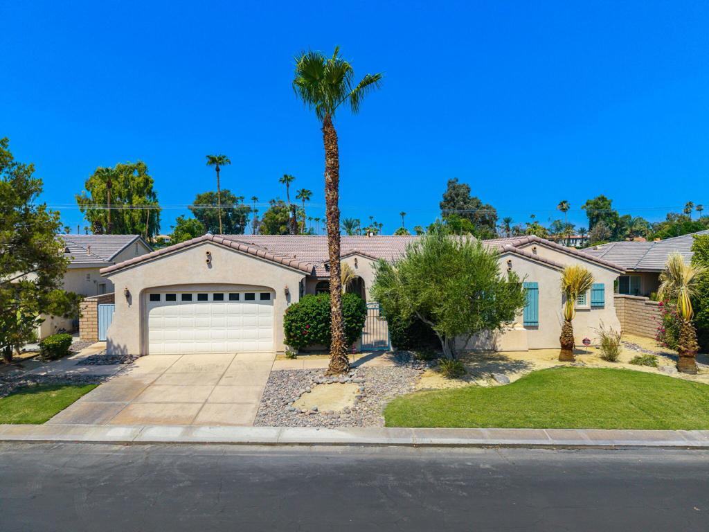 Welcome to this beautifully updated and spacious 5-bedroom, 4-bathroom home located on a large private lot in one of La Quinta's most desirable neighborhoods. Freshly painted and move-in ready, this home offers the perfect blend of luxury, comfort, and functionality. Step inside to an expansive great room with a cozy fireplace, ideal for entertaining or relaxing with family. The gourmet kitchen features a large center island with bar seating, a charming breakfast nook, and flows seamlessly into the formal dining rooma"perfect for hosting dinner parties or casual meals. The private backyard is a true oasis, featuring a stunning pool surrounded by mature hedges for ultimate privacy. New palm trees grace both the front yard and the welcoming courtyard, adding a resort-like touch. The primary suite is a peaceful retreat with direct slider access to the backyard and pool. The luxurious ensuite bath includes a soaking tub, walk-in shower, dual vanities, and an expansive walk-in closet. Two guest bedrooms feature private ensuite baths, while the remaining two share a well-appointed Jack-and-Jill bathrooma"ideal for family or guests. Enjoy the community's beautifully maintained park, scenic greenbelt areas perfect for walking, biking, or exercising, and even a Bocce Ball court for added fun. Don't miss this opportunity to own a spacious and stylish home in a prime locationa"perfect for full-time living or a luxurious desert getaway.