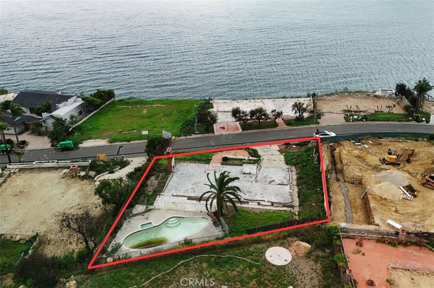 Fire rebuild opportunity in the highly desirable Big Rock Mesa neighborhood of Malibu. This approximately 13,394 sq ft mostly flat lot is situated on a quiet cul de sac just about 1/2 a mile from Pacific Coast Highway and offers sweeping ocean, mountain, and city light views. The price includes recently approved fire rebuild permits for an approximately 2,900 sq ft residence, allowing construction to begin immediately without the typical coastal approval delays, making this an excellent opportunity to build a custom home in one of Malibu’s most sought after hillside locations.
