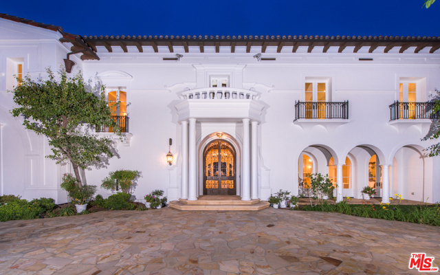 A spectacular Mediterranean estate in prime Holmby Hills that embraces the beauty of Italian renaissance design. Enter the dramatic two story grand foyer that boasts 26ft beamed ceilings, elegant archways, and an abundance of impeccable craftsmanship throughout. Main level features private office, living room, maids quarters, billiard room, card room with impressive wrought iron doors, walnut paneled wet bar & formal dining room that opens to an expansive rear yard with garden area and N/S tennis court. Also includes large kitchen with top of the line appliances & great room that opens to inviting patio with infinity pool & spa. The upstairs features luxurious master retreat with sitting area, 2 fireplaces, 2 private terraces, dual master baths with mosaic details in marble, sauna + steam, large walk in closets & gym. Additional 5 generous suites + 2 junior suites. Other features of the home include lower level with wine cellar, storage, partial solar powering & alarm/sound system.