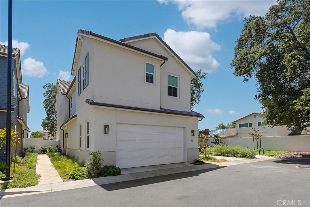 Welcome to the highly sought-after Miren community in Arcadia! This exceptional end-unit residence sits at the end of a private cul-de-sac, offering unmatched privacy and tranquility. As one of the larger floor plan in the community—once rated the best model at the time of development—this home provides the atmosphere and comfort of a luxury single-family residence. Surrounded by mature trees and adjacent to a serene side common area, the setting is both peaceful and picturesque. Inside, you'll find an array of premium upgrades, including: Expansive kitchen with ample cabinetry, upgraded countertops, and a stunning center island. Designer lighting fixtures and high-end flooring throughout. A reimagined step-in shower and a custom-designed walk-in closet in the primary suite. A sumptuous resort-like primary bathroom with views of mature oak trees, offering serene privacy. A newly renovated backyard featuring modern minimalist landscaping, ambient lighting, and shaded areas under a mature tree make this a private sanctuary for relaxation. Originally purchased in 2024 by its first and only owner, this lightly lived-in home shows practically brand new. With no direct comparison in the Miren community, this is a rare opportunity to own a truly luxurious and turnkey residence.