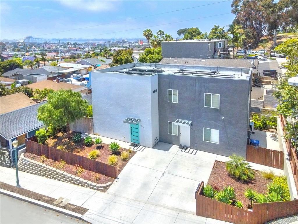 Welcome to this stunning newly constructed (2022) custom-designed triplex, ideally situated in the heart of San Diego’s historic Grant Hill neighborhood. This modern residence offers breathtaking views of the Coronado Bridge and San Diego Bay, along with an exceptional blend of luxury, comfort, and income potential. The main unit (#348) features 2 spacious bedrooms, 2.5 bathrooms, approximately 1,172 sq ft of living space, an open-concept floor plan with sleek modern finishes, a private backyard patio, and its own dedicated solar system. Perfect for owner-occupancy or premium rental. The second and third units (both addressed as #350) offer fantastic rental income potential. Unit 2, located on the ground level, includes 1 bedroom and 1 bathroom across approximately 527 sq ft. Unit 3, located on the upper level, features 1 bedroom and 1 bathroom with approximately 584 sq ft. Both units share a separate solar system and are currently being operated as successful Airbnb rentals, producing an impressive $55,713 in net income in 2024. This versatile triplex is perfect for multi-generational living or as a long-term investment property. Enjoy the convenience of being just minutes from Downtown San Diego, major freeways (I-5, I-15, and CA-94), shopping centers, popular restaurants, and beautiful local parks. Don't miss this incredible opportunity to own a nearly new, income-generating property in one of San Diego's most vibrant and up-and-coming neighborhoods. This is a must-see!