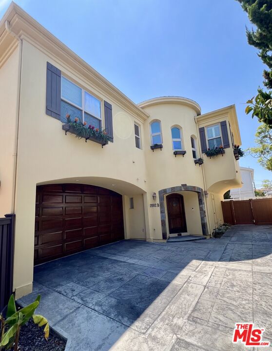 Welcome to the charming Redondo Beach/Villas North neighborhood. This gorgeous, newly renovated townhome offers modern upgrades and unbeatable proximity to South Bay's most exciting attractions and amenities. This stunning 4-bedroom, 3.5-bathroom Spanish-style home combines elegance and convenience, delivering the perfect blend of privacy and accessibility. Step inside to a beautifully mosaic-tiled entryway and discover a light-filled dining area and spacious living room. The adjacent gourmet kitchen flows seamlessly from the living space and features granite countertops, stainless steel appliances, and ample cabinet storage. From the entryway, a striking spiral staircase leads you to all four bedrooms and a convenient laundry room equipped with a washer and dryer. The luxurious primary suite includes a private balcony, cozy double-sided fireplace, walk-in closet, and an en-suite bathroom complete with a frameless glass shower, bathtub, and a view of the double-sided fireplace for extra ambiance. Three additional bedrooms are generously sized, perfect for family, guests, or a home office. Two of the bedrooms share a well-appointed full bathroom with a double vanity, while the fourth bedroom enjoys the privacy of its en-suite bathroom. Step out to the private patio, seamlessly accessible from the living room, to enhance your indoor-outdoor living and entertaining experience. Parking is effortless with an attached two-car garage and a driveway, and the garage includes an automatic opener for added convenience. Location is everything and this home delivers. Situated within walking distance of top-rated schools and beautiful local parks, you'll also enjoy close proximity to beaches, shopping centers, and a wide variety of dining options.