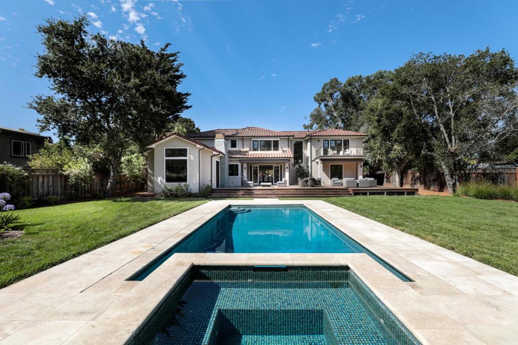 Price Improvement~ Don't miss out on this one-of-a-kind custom built, modern Mediterranean exterior, contemporary interior, wonderfully spacious floor plan and inviting rear grounds with pool, spa, expansive deck with retractable awnings for year round entertaining. Streamlined and bright interiors over 2 levels with approx. 5,890 sq.ft. European white oak floors throughout home. Theater with new carpet and dedicated office on 1st floor. 5 bedrooms, each ensuite, one of which is located on the first floor, plus 2 half-baths. Approved plans for a 1 bedroom-1 bath ADU. Nearly one-half acre on border of Atherton in West Menlo. Excellent Las Lomitas Schools!