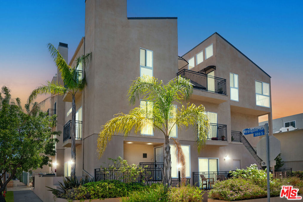 This exceptional townhouse-style residence offers an abundance of sunlight from East, West, and South-facing exposures ensuring bright, sun-drenched living spaces all day long in this stunning Architectural Penthouse. Enter through the two-story foyer where sensational 19-foot vaulted ceilings greet you, setting the tone for the airy open feel that flows throughout this meticulously designed home. Upstairs, the dramatic living room is the heart of the home, where 14-foot vaulted ceilings and custom Velux electric "Fresh Air" skylights with rain sensors allow sunlight to pour in. The light-filled space, complete with 15 Milgard double-paned windows and doors, is perfect for both relaxation and social gatherings. A private patio off the living room is ideal for alfresco dining under the California sky. This penthouse offers two expansive bedroom suites, each designed with privacy and comfort in mind. The upstairs Primary Suite features vaulted ceilings, a wood-burning gas fireplace, spacious walk-in closet, and two patios. The primary bath is complete with a skylight, spa tub, shower, and double sinks. This thoughtfully designed layout features a second bedroom suite downstairs, providing privacy and flexibility for guests, a home office, or a roommate setup. Boutique style 4-unit complex fully remodeled 2006-2008 featuring low HOA dues, two car side-by-side gated parking, and multiple storage rooms. Just a short distance to restaurants and cafes along Montana and San Vicente Blvd, the Brentwood Farmers Market, the Brentwood Country Club, Wholefoods, and more. Stunning natural light!