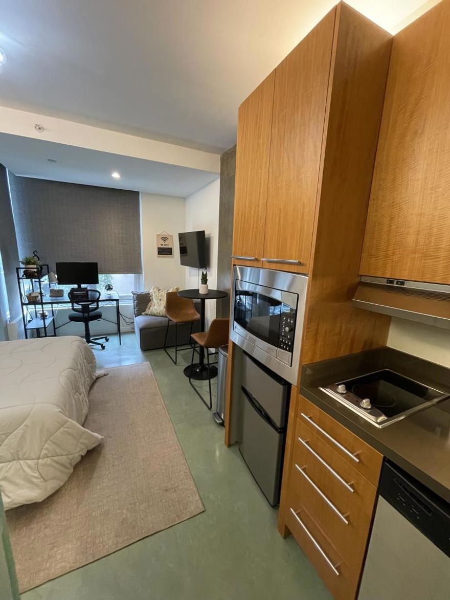 Located at the quiet rear of the building and overlooking Rizal Street, this stylish studio offers modern comfort in a prime central location. Abundant natural light fills the space through large windows, while radiant-heated concrete floors add warmth and contemporary appeal.  The kitchen features stainless steel appliances, an electric cooktop with exterior venting, and a sleek modern hood. A glass door opens to a private balconyperfect for relaxing or enjoying your morning coffee. The bathroom is elegantly appointed with stone tile and a frosted glass wall and door that allow natural light to filter in while maintaining privacy.  Convenient amenities include same-floor laundry, a dedicated storage room on the basement level, and first-come, first-served bike storage. Residents also enjoy access to a stunning rooftop terrace with panoramic city views, three stylish glass-walled cabanas, and two BBQ grillsideal for entertaining or unwinding.  Just steps from Whole Foods, Union Square, Yerba Buena Gardens, South Park, and the Moscone Center, with easy access to public transit and the 101 South freeway right on Harrison Street, this location is truly unbeatable. Great for long-term Airbnb stays or those seeking a well-connected, low-maintenance urban retreat.