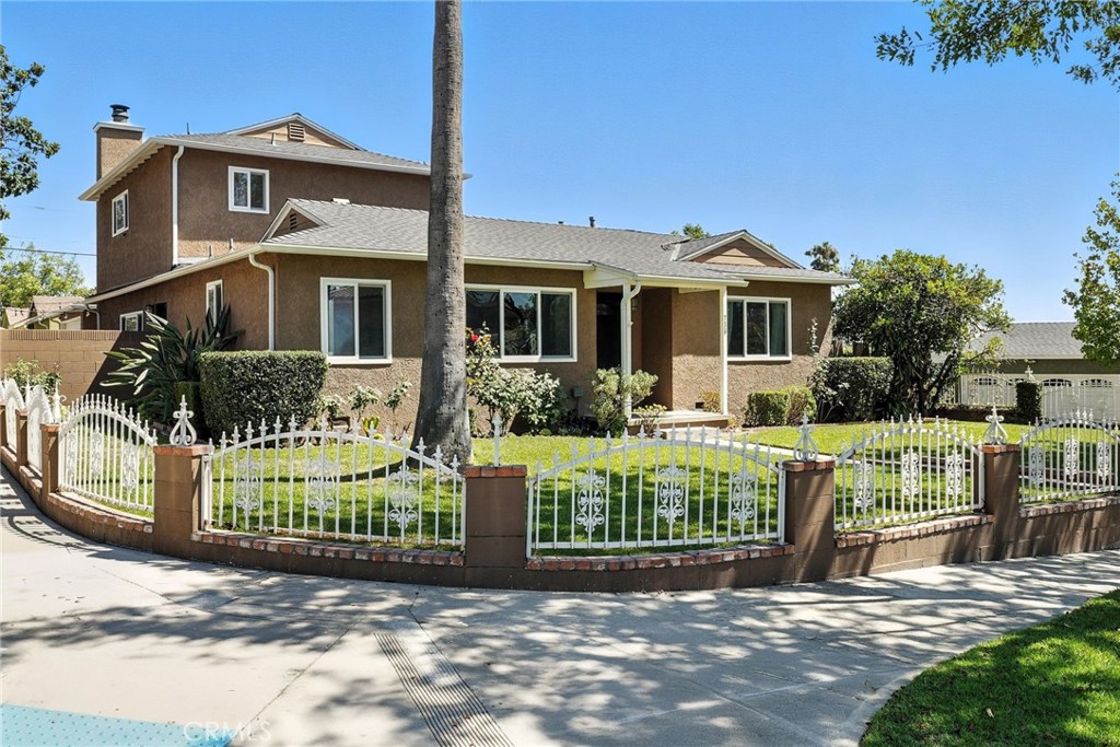 Located on a prime corner lot in the sought-after Burbank Hills, this spacious four-bedroom, two-and-a-half bathroom home offers comfort, charm, thoughtful updates, and panoramic valley views. With an ideal blend of functionality and style, this is the type of home that feels inviting from the moment you walk in, and is large enough to truly set down roots.
Inside, real wood floors bring natural warmth and character, while a cozy gas fireplace anchors the light-filled living room. The galley kitchen, outfitted with stainless steel appliances, is comfortably efficient and sits adjacent to an oversized dining and entry area — perfect for extended family gatherings and offering great potential for a future dream kitchen expansion.
Upstairs, the extra-large and exceptionally private primary suite serves as a true retreat — thoughtfully separated from the rest of the home on its own second floor. It features a generous walk-in closet and a beautifully remodeled ensuite bathroom with a walk-in tiled shower and dual sink vanity. Downstairs, a separate bedroom wing offers three bedrooms that share both a full and half hallway bathrooms.
Recent upgrades include all remodeled bathrooms, newer roof (2019), blown-in insulation in all exterior walls and attic and dual-pane windows throughout for exceptional energy-efficiency.
Outdoor living is just as inviting. A covered patio — with exterior lighting and ceiling fan — creates a breezy transition between the home and the detached two-car garage, making it the perfect setting for alfresco dining or relaxed summer evenings. The expansive, grassy backyard features a custom redwood play structure, ideal for hours of imaginative play and enjoyment.
Beyond the home itself, you'll enjoy access to the highly regarded Burbank schools and the city’s exceptional public services, including its own police, fire, parks, libraries and utilities.
Comfortable, updated, and ideally located, this Burbank Hills beauty is ready to support your everyday lifestyle and long-term vision in one of the city’s most beloved neighborhoods.