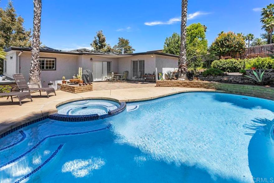 This 3-bedroom, 2-bathroom home blends contemporary comfort with unbeatable city views—and your own private backyard paradise. Inside, enjoy a light-filled open floor plan with a spacious living and dining area, perfect for entertaining. Step outside and discover your private oasis: an in-ground swimming pool and hot tub perfect for relaxing evenings or weekend gatherings. Whether you're taking a morning swim or unwinding under the stars, this outdoor space is a true highlight.  Additional features include central heating and cooling, in-home laundry, and dedicated parking.  Located just minutes from premier dining, shopping, parks, and transit, this home offers the best of both city convenience and luxurious leisure.