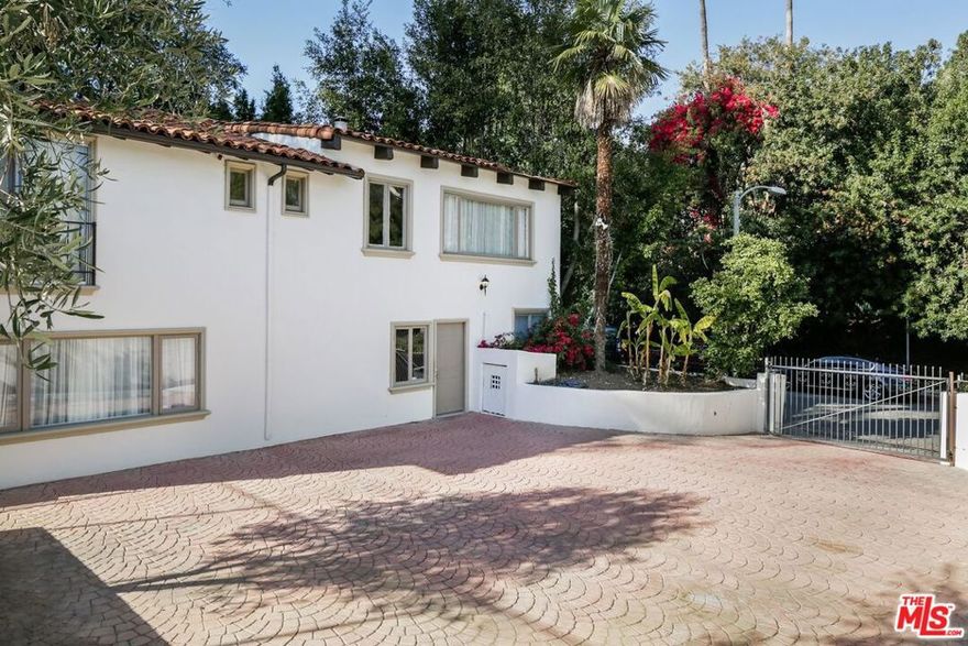 Unrivaled value and location directly across from The Beverly Hills Hotel. This ultra-private remodeled 3BD/2BA guest residence features its own gated entrance and motor court, offering discretion and exclusivity. Charming interiors open to an outdoor lounge and deck enveloped by mature greenery. The layout includes two bedrooms and one bathroom on the main level, with a private third bedroom upstairs. Complete with a full kitchen and in-unit washer/dryer. Access to Beverly Hills schools and city services. $750/month utility fee. A rare lease opportunity in Beverly Hills' most iconic enclave.