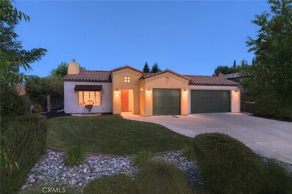 Exceptional Single-Level Living in the Sought-After Del Oro Neighborhood! Welcome to this beautiful 3,000+/- sq. ft. home in the prestigious Del Oro community at Hacienda Hills. Showcasing the popular and spacious “Granada” floorplan, this 4-bedroom, 2.5-bath residence offers the perfect blend of comfort, style, and functionality—ideal for both entertaining and everyday living. Step inside to find a formal living room with a cozy fireplace and a separate dining room accented by custom built-ins. The gourmet kitchen is a chef’s delight, featuring abundant cabinetry, solid surface countertops, an expansive breakfast bar, and an open layout that flows effortlessly into the warm and inviting family room—complete with a second fireplace. Soaring volume ceilings, 8' interior doors, and an abundance of windows create a bright and open ambiance throughout the home, with picturesque views overlooking the landscaped yard and Chandler Ranch hills beyond. The expansive primary suite is your private sanctuary, offering patio access, a massive walk-in closet, and a spa-like en-suite bath with dual vanities, a soaking tub, and separate shower. A large laundry room with utility sink and a finished 3-car garage add everyday convenience, plus owned solar system for energy efficiency. Enjoy the best of Central Coast living outdoors with landscaped yards, expansive concrete patio or basketball court, spa, and two covered patios—perfect for hosting gatherings or enjoying morning coffee. This move-in ready home is a rare opportunity in one of the area’s most desirable neighborhoods. Come see it today—you’ll fall in love!