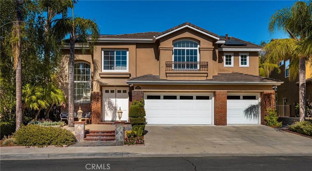 Stop looking! You won't find a better value or anything comparable in Irvine at this price. Live the Southern California lifestyle you've dreamed of in this enchanting community of Portola Hills, surrounded by picturesque rolling hills. This premier mid-cul-de-sac location on a tree-lined street features a large, pool-sized lot with an outdoor kitchen featuring a BBQ, bar, sink, separate burner, and fire pit—all perfect for al fresco dining and entertaining. This stunning home boasts charming curb appeal in the highly sought-after “Crown Pointe Tract,” showcasing exceptional craftsmanship and spacious living areas that create an airy and inviting ambiance throughout this spectacular home. Just minutes from the Irvine Spectrum, this entertainer's dream home is situated on a sprawling 7,169 sq. ft. interior lot, featuring five spacious bedrooms, four bathrooms, a large loft, and a three-car garage with 3,514 sq. ft. of comfortable living space. As you enter the home, you'll notice the soaring two-story ceilings, formal living room, and dining room with French doors leading to the expansive backyard. The chef in you will love this open kitchen, featuring Euro white cabinetry, a large center island, double ovens, microwave, dishwasher, walk-in pantry, recessed lighting, and a breakfast nook. The adjoining family room, featuring a warm fireplace, is perfect for family gatherings and opens effortlessly to the outdoor living spaces. The convenient downstairs bedroom and full bathroom are ideal for out-of-town guests. There's also a mudroom area just inside the garage—a perfect place to store shoes and backpacks—and a large downstairs laundry room with a sink. As you make your way upstairs, you will notice the spacious loft/media room. The huge primary suite is a romantic retreat, featuring high-volume ceilings, a walk-in closet with organizers, dual vanities, an oval soaking tub, a separate shower enclosure, and a vanity area. There is an additional en-suite bedroom and two more spacious bedrooms that share a secondary bathroom with dual vanities. Custom upgrades include new interior paint, vinyl windows, upgraded baseboards, mirrored wardrobes, ceiling fans, luxury vinyl flooring throughout, and a solar system owned by the seller. Sellers have priced this wonderful home to sell fast! Hurry!