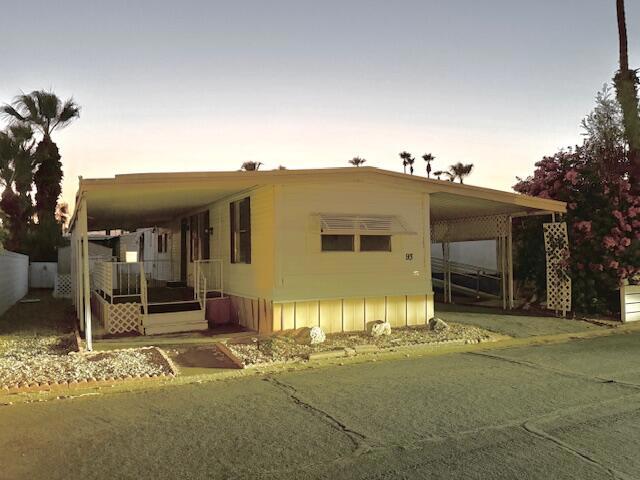 Sweet deal, Heres a 2 bedroom 2 full bath single wide home in Palmdale Estates 55+ community adjacent to Indio Polo Grounds, with fresh interior paint, new baseboard throughout, new plumbing in bathroom, new flooring in bathroom, new vanity, sink, toilet, new water heater. This cute little gem comes with a shed that is made into a laundry room, includes washer & dryer, stove, HVAC commercial sized and works great! Palmdale Estates has RV parking available which is great to have. Come and finish up and put your own taste into the rest! Not pre-hud and financeable with 5% down! Space rent for new owners $706.00 plus water & trash. Must be park approved to open escrow. Call for a showing today..