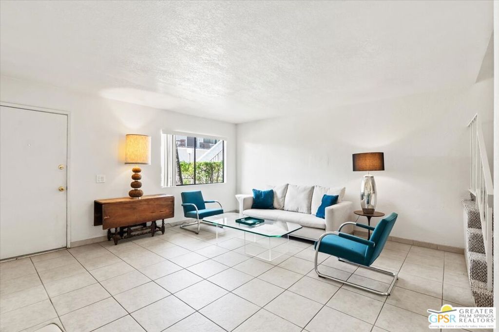 Home sweet home! Own your own fee simple condo with a private one car garage! Welcome to the Casa De Oro subdivision in the Little Tuscany area of Palm Springs! This 2 bedroom 2 bath townhome features new carpet upstairs! MLS data shows unit had plumbing and electrical updates in 2005. Kitchen has recessed lighting and there is a large private patio to enjoy! Entertain at home, on the tennis court, by the pool or go out and enjoy wonderful uptown Palm Springs! Some famous nearby businesses include Billy Reed's Restaurant Est. 1975, The Rivera Palm Springs Hotel Est. 1959, Boozehounds Est. 2020, and Toucans Tiki Lounge!! Your quintessential Palm Springs lifestyle is here! Buyer to verify all info.