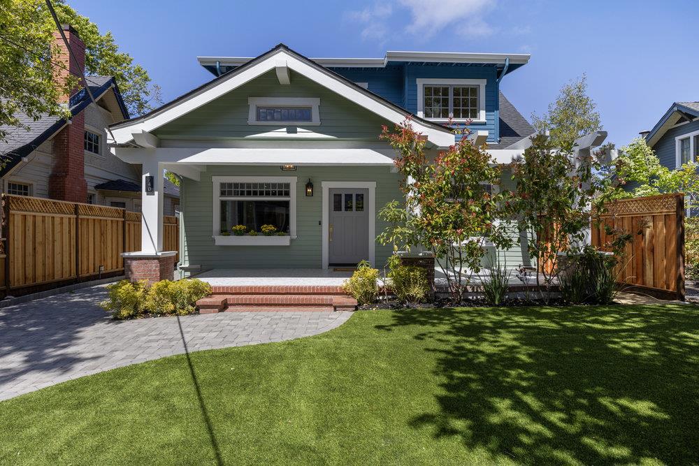 Thoughtfully reimagined, this Craftsman blends timeless character with high-end updates over 3,000 square feet of living space. The main level features a gracious living room, formal dining, and a showstopping kitchen with custom cabinetry, premium appliances, walk-in pantry, and oversized island. A spacious family room with built-in bar, fireplace, and sliding doors opens to a landscaped yard ideal for indoor-outdoor living. This retreat has two bedrooms, and two full bathrooms to complete the main level. Upstairs, the luxe primary suite includes a spa-like bath and custom walk-in closet. Two additional bedrooms, stylish baths, and a full laundry room offer comfort and functionality. Wide-plank floors, designer lighting, and refined finishes throughout. Prime location near our top rated schools (just a walk less than one block to McKinley Elementary School, parks and downtown.